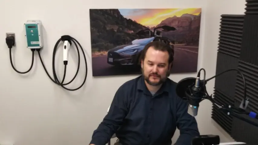 Christopher Howell of OpenEVSE recording the podcast! An OpenEVSE charger is on the wall behind him. Christopher Howell of OpenEVSE recording the podcast! An OpenEVSE charger is on the wall behind him.