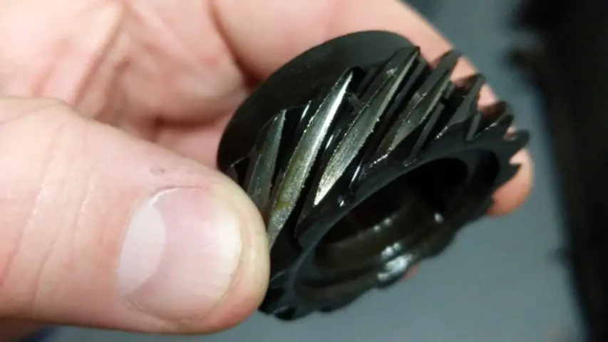 Gears are not supposed to be shiny and sharp! Cam distributor gear is all chewed up. Gears are not supposed to be shiny and sharp! Cam distributor gear is all chewed up.